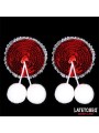 Cache-tétons à paillettes rouges et pompons blancs